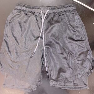 New men’s athletic shorts. Size Medium in the color Black